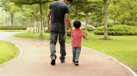 Father And Son Walking Away From Each Other