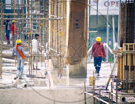 image  construction site  india  dusk  workers people labor