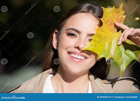 Autumn Woman With Fall Yellow Maple Leaf Outdoor Portrait Beautiful