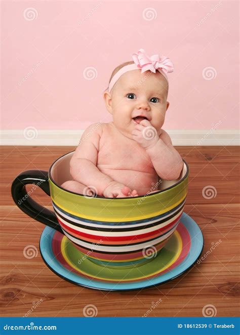 Baby in a tea cup stock image. Image of little, face - 18612539