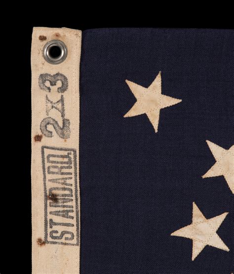 13 STAR ANTIQUE AMERICAN FLAG WITH A MEDALLION CONFIGURATION OF STARS