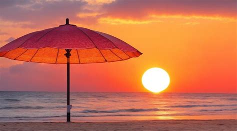 Premium AI Image | Sunset in a beach and a umbrella by Generative AI