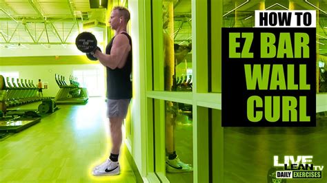 How To Do A STANDING EZ CURL BAR WALL CURL WITH NARROW GRIP Exercise