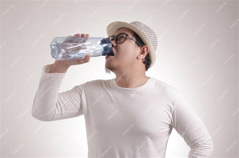 Premium Photo Healthy Man Drink Mineral Water In Bottle