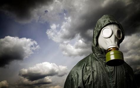 Premium Photo Person Wearing Gas Mask Against Sky