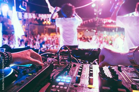 Dj Mixing Outdoor At Beach Party Festival Outdoor With Crowd Of People