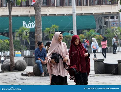 Two Muslim Women Indonesian Walking In The Fatahillah Square At Old