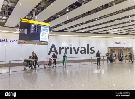 Passengers in arrivals hall, Heathrow airport, London, England, UK ...