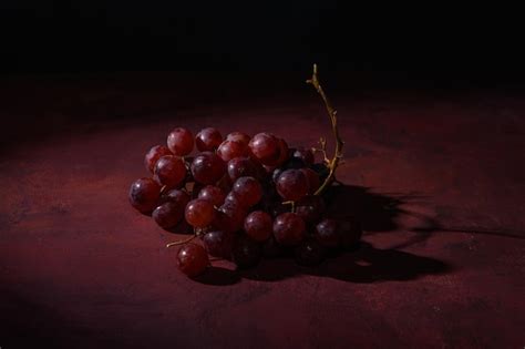 Premium Photo | Red ripe grapes on a rustic table