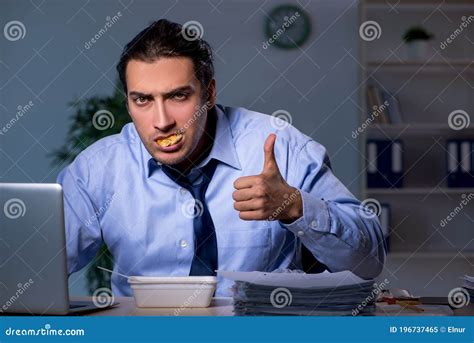 Hungry Employee Working Late In The Office Stock Image Image Of