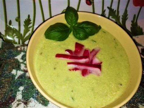 A Yellow Bowl Filled With Broccoli And Radishes On Top Of A Table