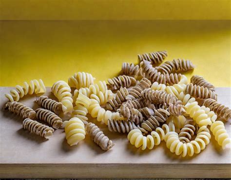 Premium Ai Image Raw Whole Grain Fusilli Pasta And Gnocci Pasta