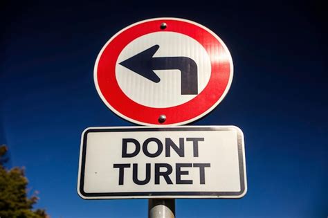 Do Not Turn Left Traffic Sign Isolated On Black Background With