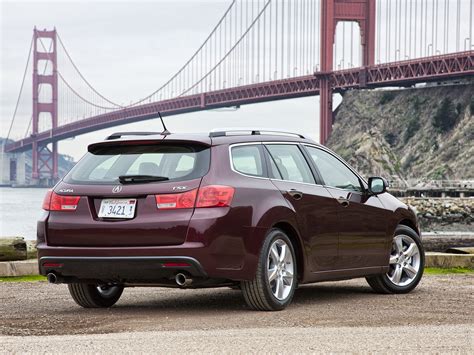 Maroon Acura station wagon parked near golden gate bridge during ...