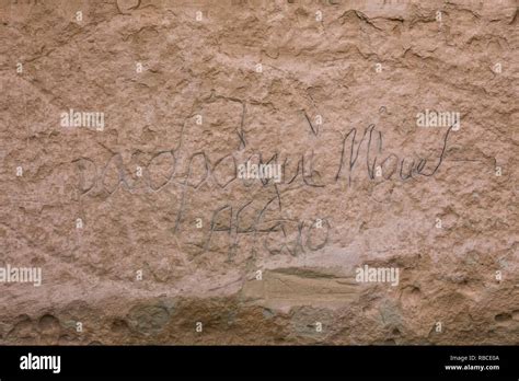 Spanish inscriptions in elegant script viewed along the Inscription Rock Trail in El Morro ...