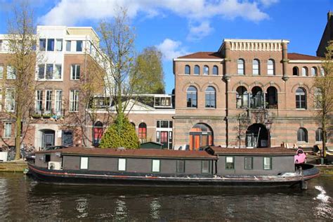 Amsterdam Walking Tour and Canal Cruise | GetYourGuide