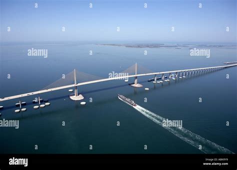 Scenic Aerial Photo Of Sunshine Skyway Bridge And Cargo Ship Passing