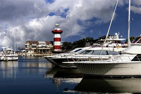 Sea Pines Lighthouse and Yachts Photograph by Norma Brandsberg | Pixels