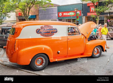 Brightly Painted Vintage Panel Van Emblazened With A Harley Davidson