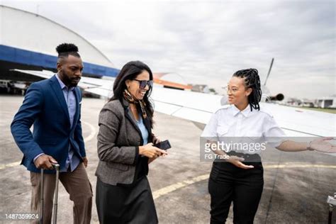 Stewardess Welcoming Photos And Premium High Res Pictures Getty Images