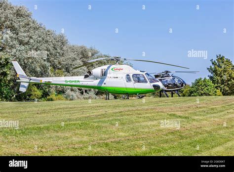 A Gallagher and a McDonnell Douglas Helicopter landed on grassland near ...