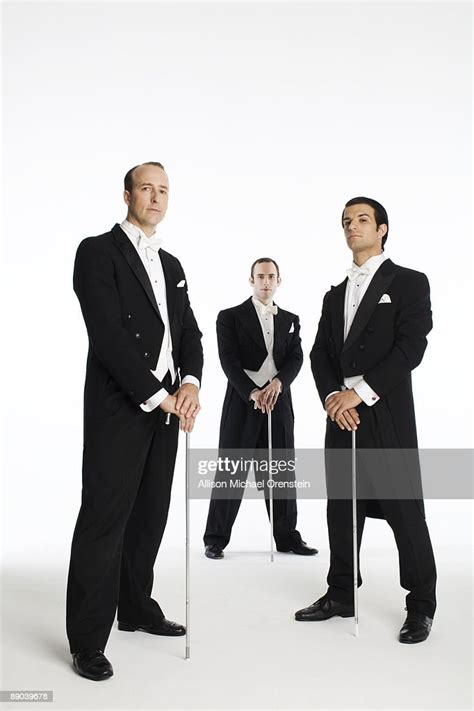 Three Men In Tuxedos With Canes High Res Stock Photo Getty Images