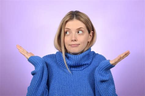 Premium Photo Surprised Cute Beautiful Blonde Woman Spread Her Hands To The Side