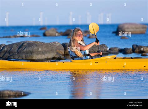 Young woman kayaking Stock Photo - Alamy