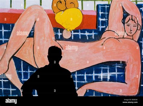 Man Studying Poster Of Pink Nude 1935 Henri Matisse Stock Photo Alamy