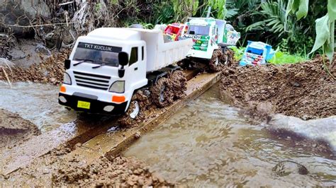 Mobil Truk Dump Muatan Pasir Batu Kali Full Jalur Berlumpur Bak