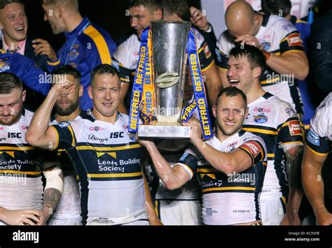 Leeds Rhinos Players Celebrate With The Super League Grand Final Trophy