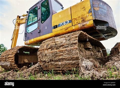 Yellow Excavator On Construction Site Heavy Construction Machine