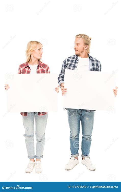 Young Caucasian Couple Holding Blank Banners In Hands Stock Photo