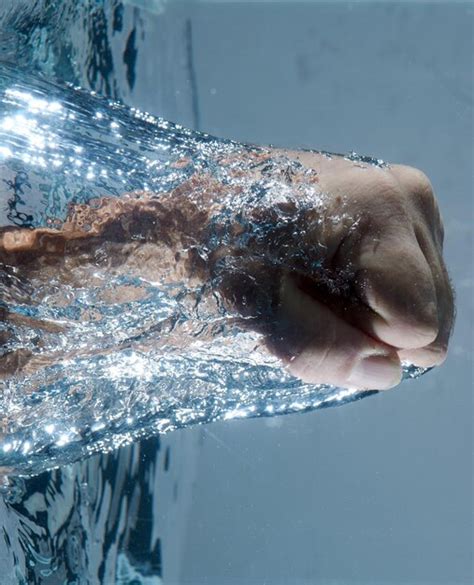 Premium Photo Cropped Hand Of Person Coming Out From Water