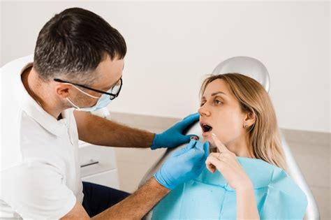 Premium Photo Attractive Woman Afraid Of Dentist Dentist Consults