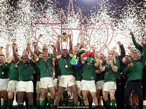 The South African Rugby Team Celebrate With Their Trophy And Confetti