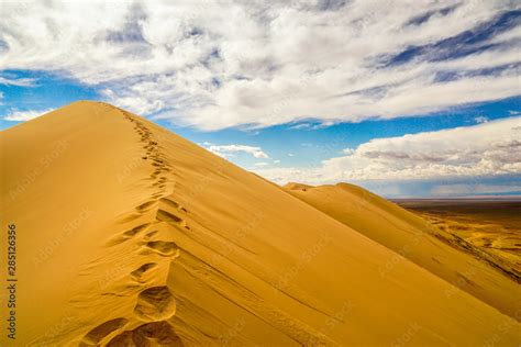 Khongor Sand Dunes In Gobi Desert Mongolia With Single Foot Steps In