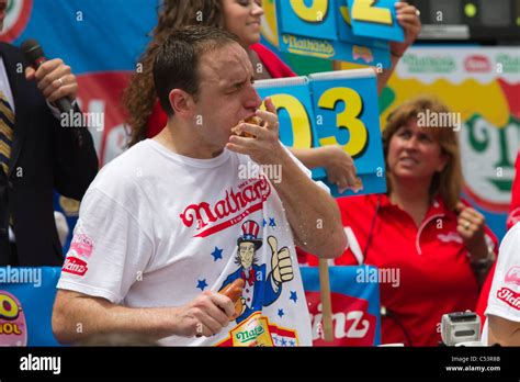 Joey Chestnut Eating One Of The 62 Hot Dogs That Earned Him The Mens