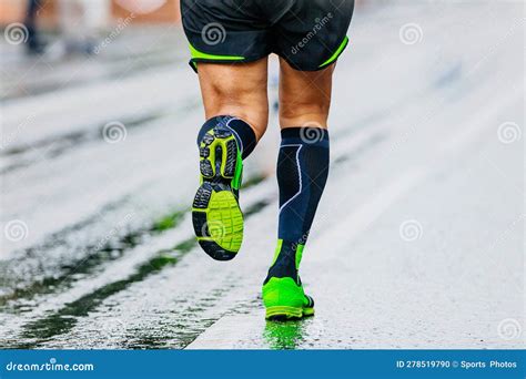 Close Up Legs Runner Athlete Running Marathon In Black Compression