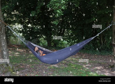 Man Resting In A Hammock France Stock Photo Alamy