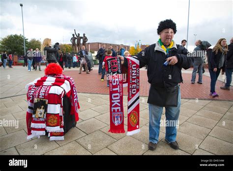 Man Selling Merchandise Outside Old Trafford Football Stadium In Stock