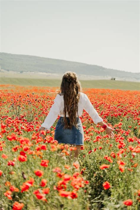 Woman Poppies Field Back View Of A Happy Woman With Long Hair In A