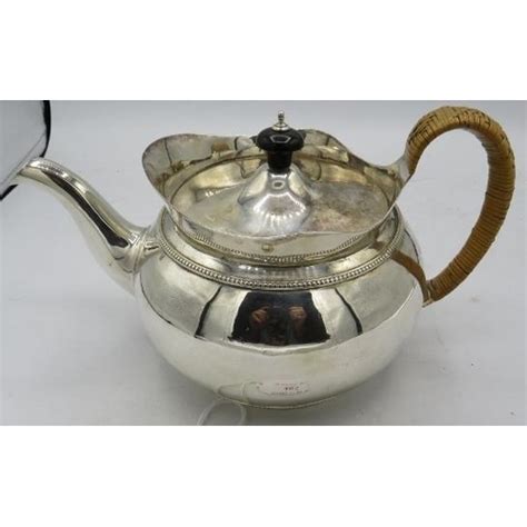 A Good Quality Victorian Silver Teapot With Wicker Handle London 1852