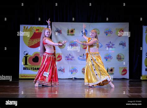 Dancers In A Native Dresses Performing Oriental Dance On Stage