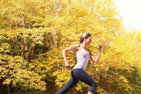 Premium Photo Pretty Fit Blonde Jogging Against Peaceful Autumn Scene