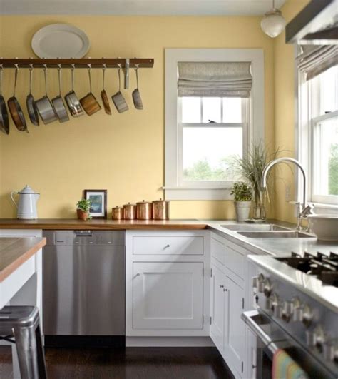 Kitchen Pale Yellow Wall Color With White Kitchen Cabinet For Country