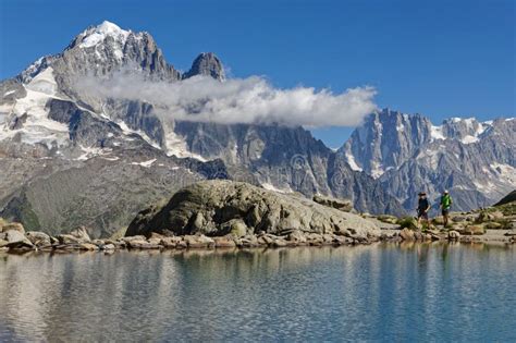 Hikers On The Lac Blanc Shore Near Mont Blanc Editorial Photography