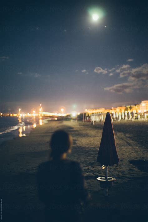 Woman On The Beach At Sunset Del Colaborador De Stocksy Tommaso Tuzj