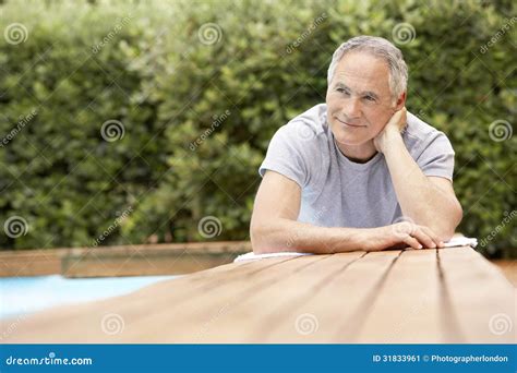 Man Reclining By Poolside Stock Image Image Of Outdoors