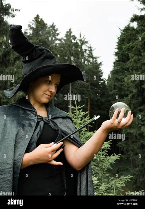 Witch With Wand And Glass Ball Stock Photo Alamy